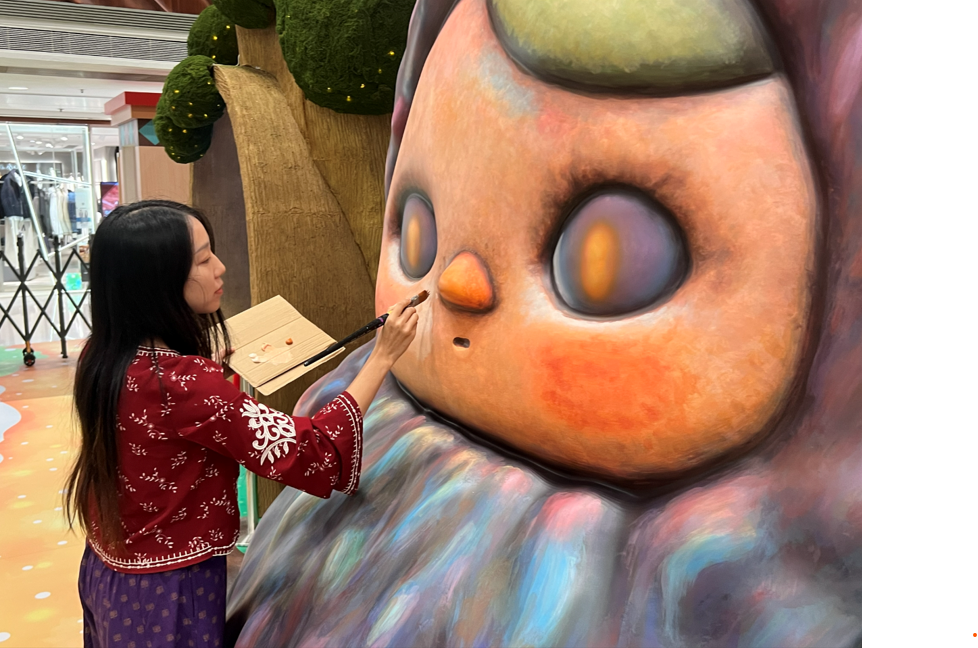 A person painting a large statue

AI-generated content may be incorrect.