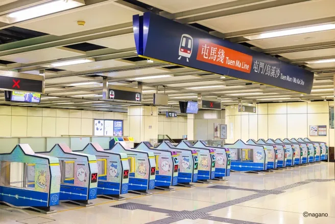A row of machines in a subway station

AI-generated content may be incorrect.
