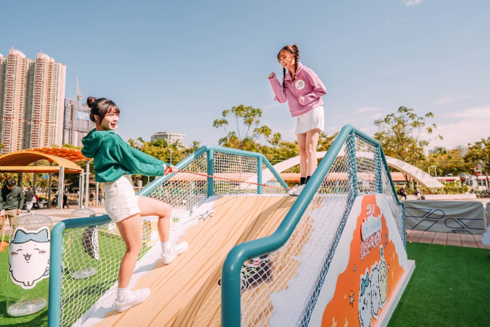 Two girls on a slide

Description automatically generated
