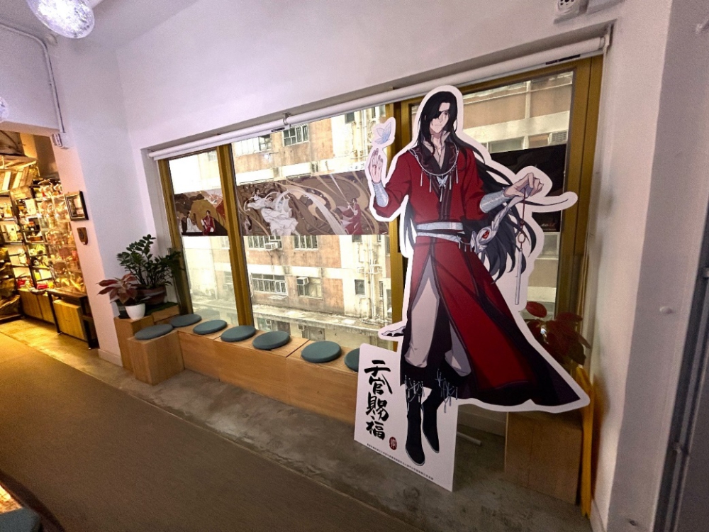 A large cardboard cutout of a cartoon character in a room

Description automatically generated