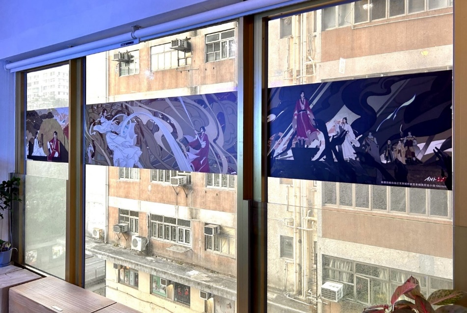 A window with a couple of posters

Description automatically generated