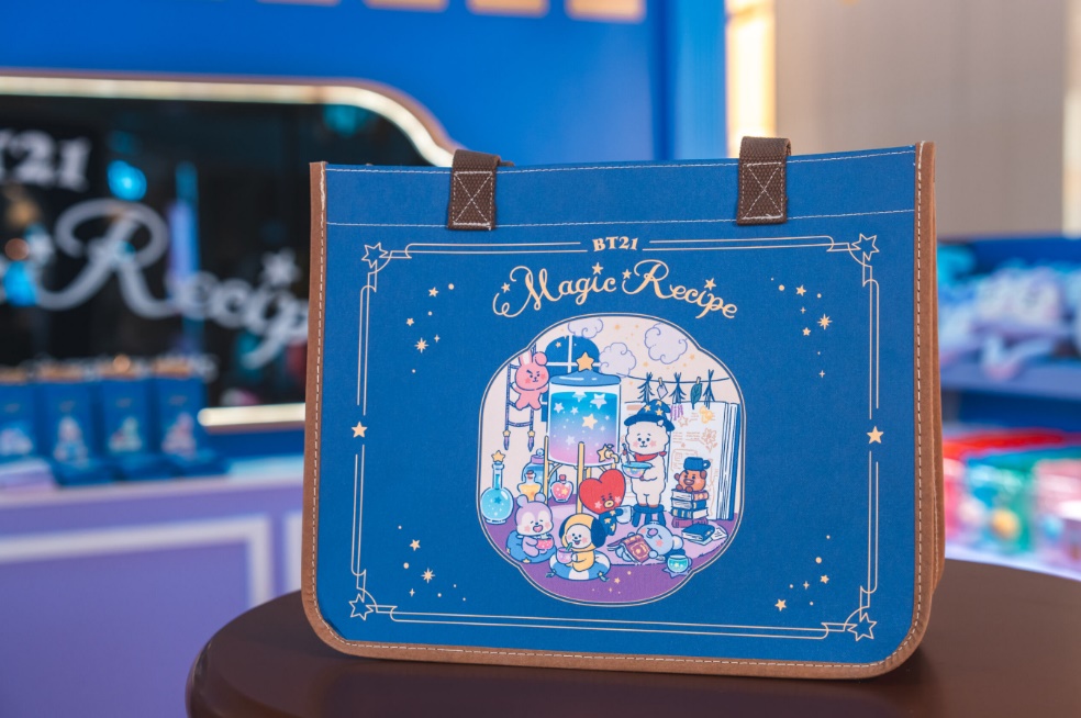 A blue bag with cartoon characters on it
Description automatically generated