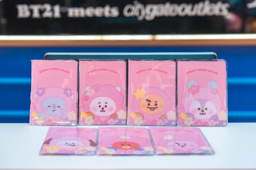 A group of pink cards with cartoon faces

Description automatically generated