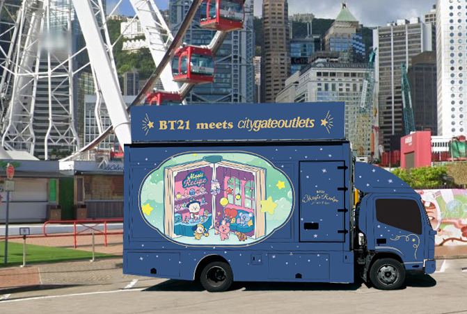 A blue truck with a ferris wheel in the background

Description automatically generated