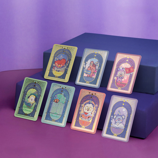 A group of cards on a purple surface

Description automatically generated