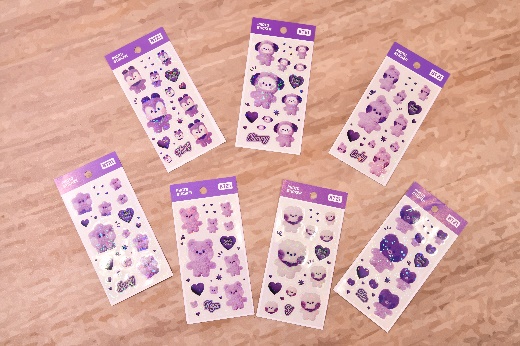 A group of stickers on a table

Description automatically generated