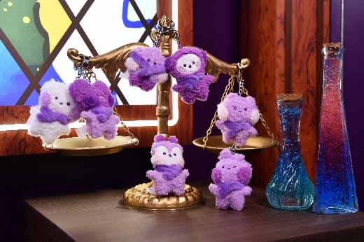 A scale with stuffed animals on it

Description automatically generated