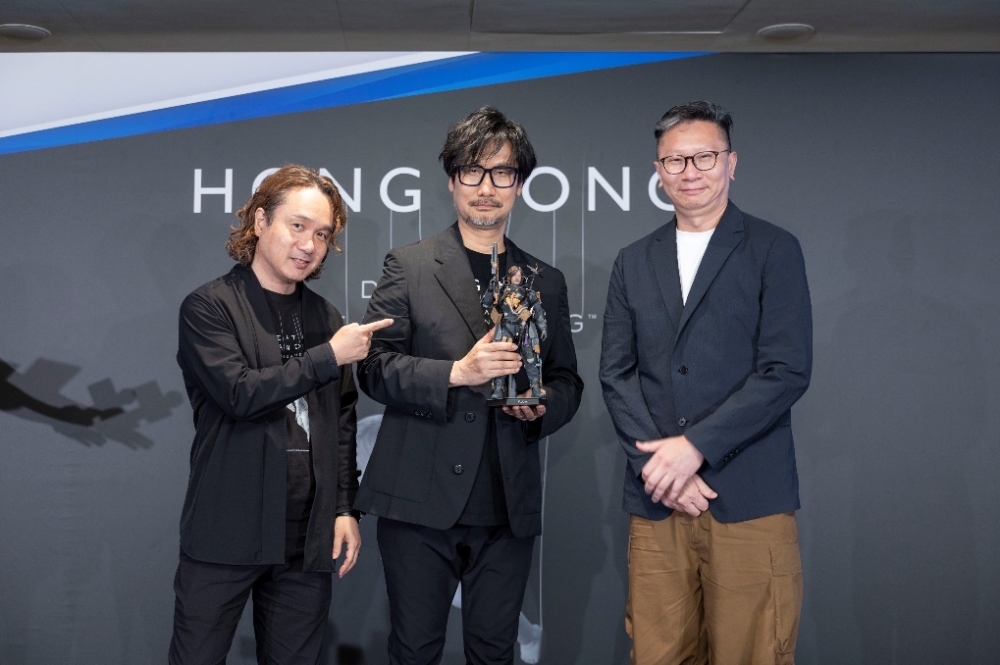 A group of men standing in front of a grey wall

AI-generated content may be incorrect.