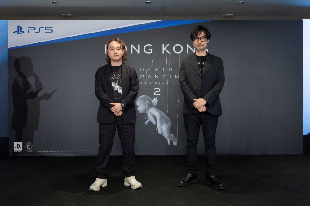 Two men standing in front of a wall

AI-generated content may be incorrect.