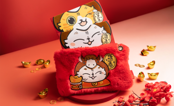A red pouch with cartoon cats on it AI-generated content may be incorrect.